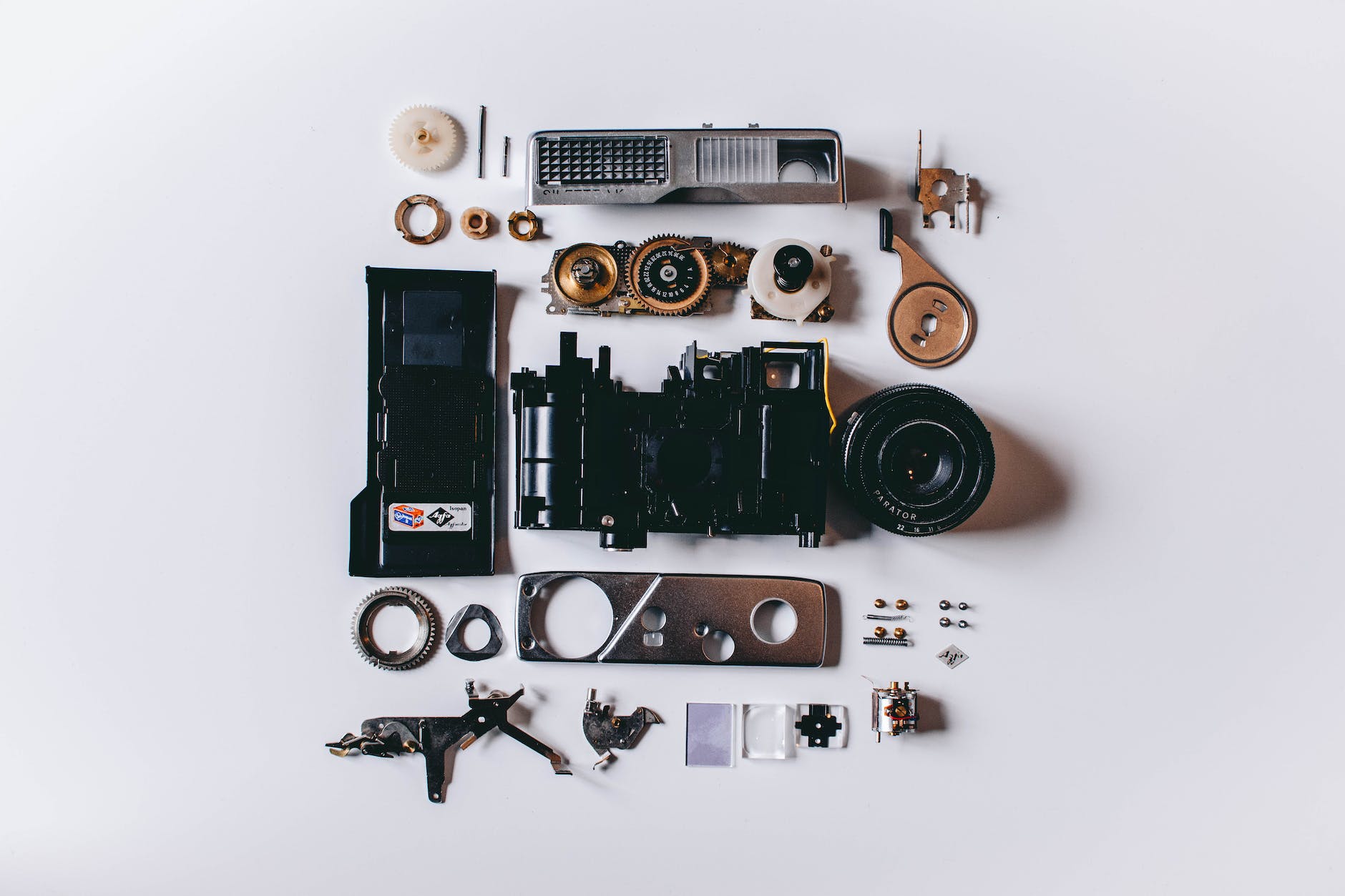 flat lay photography of black and gray components on white surface